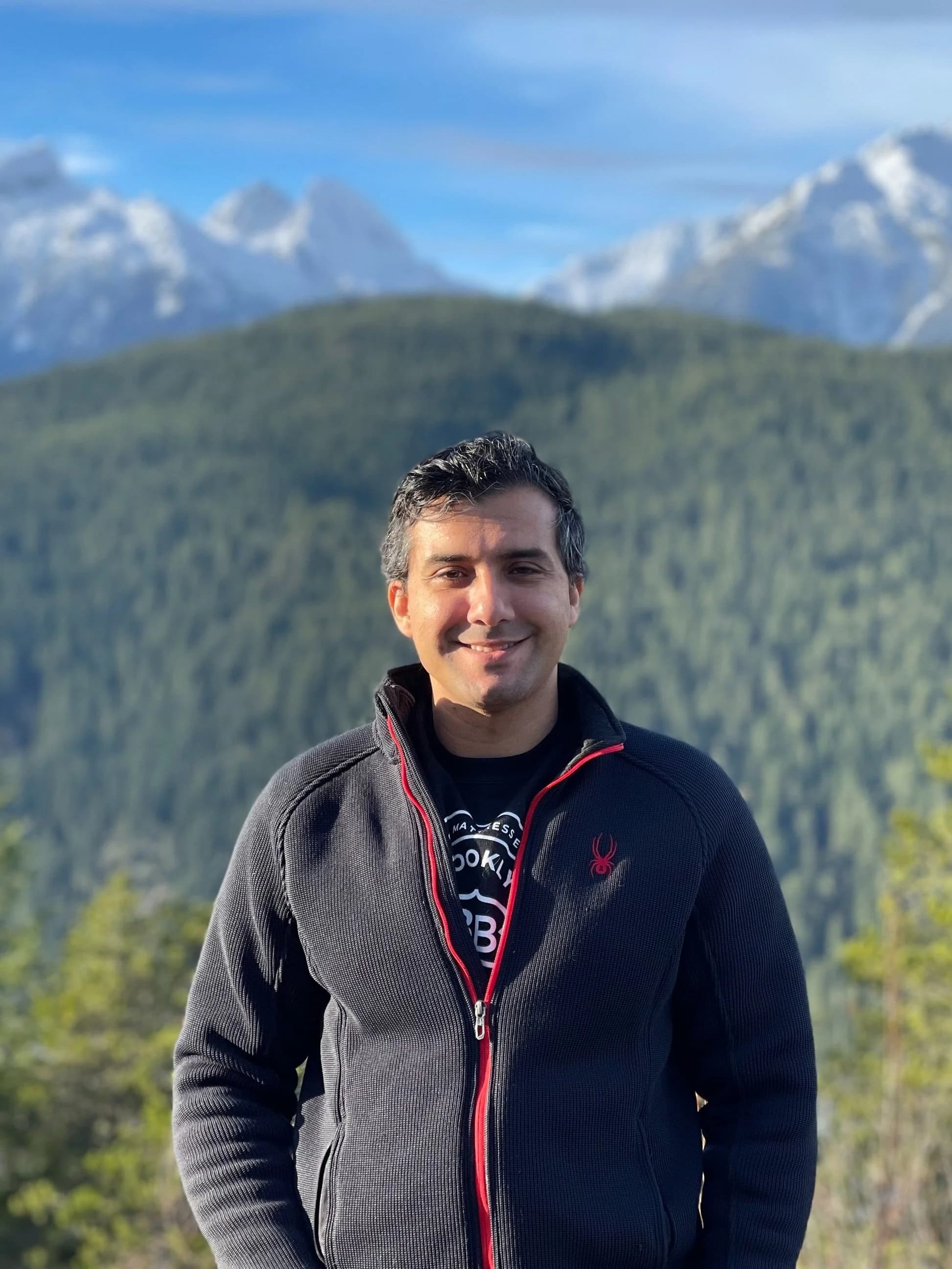 Farhad Fetrat, founder of PugetNest, with Cascade mountains in the background